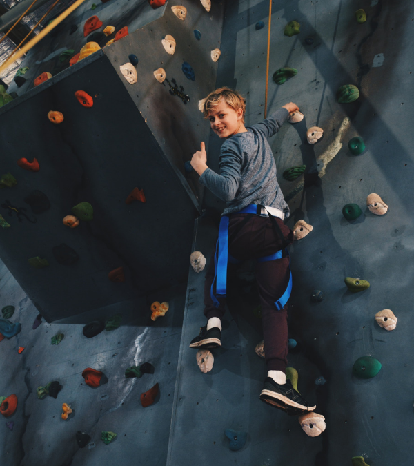 Boy rockclimbing